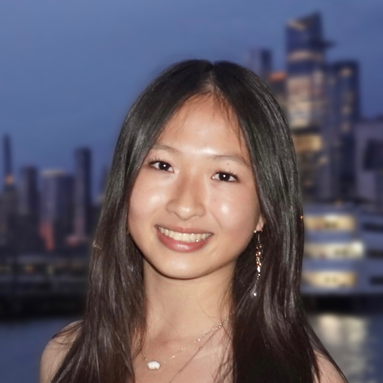 Portrait of Sonia Shum, founder of Lab-a-cadabra, smiling against a city skyline.