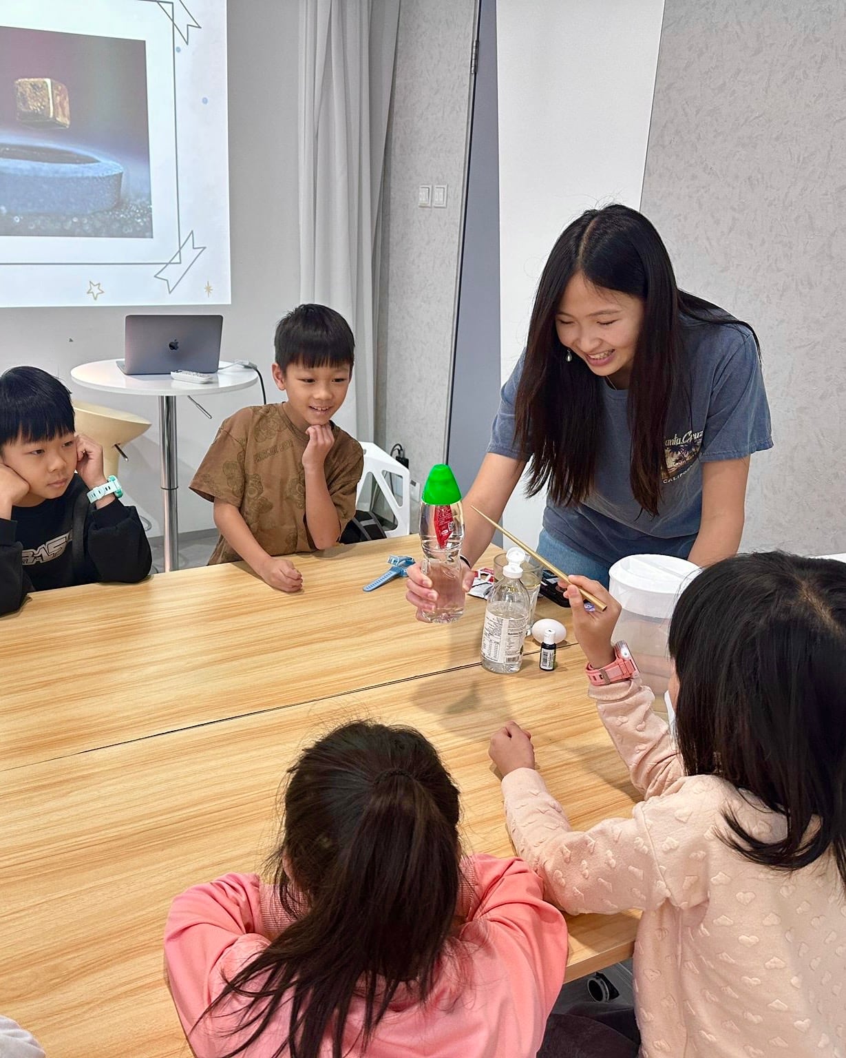 Sonia Shum demonstrates a science-and-magic experiment for children in Hong Kong.