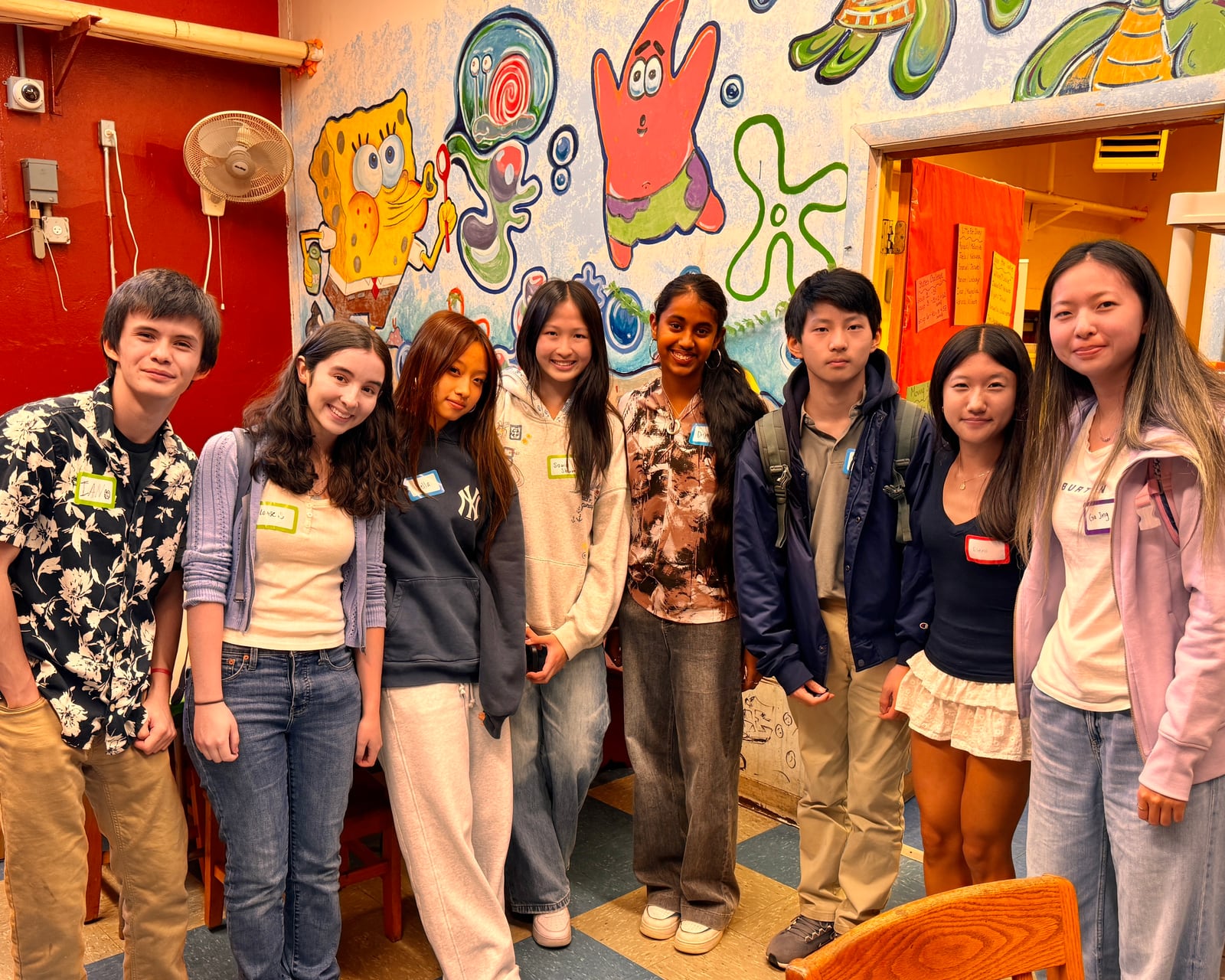 The Magic STEM Bus student team gathers after a high school service event.